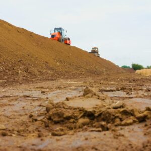 Construction site showing earthworks and heavy machinery working