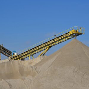 Conveyor belt creating large sand pile in quarry
