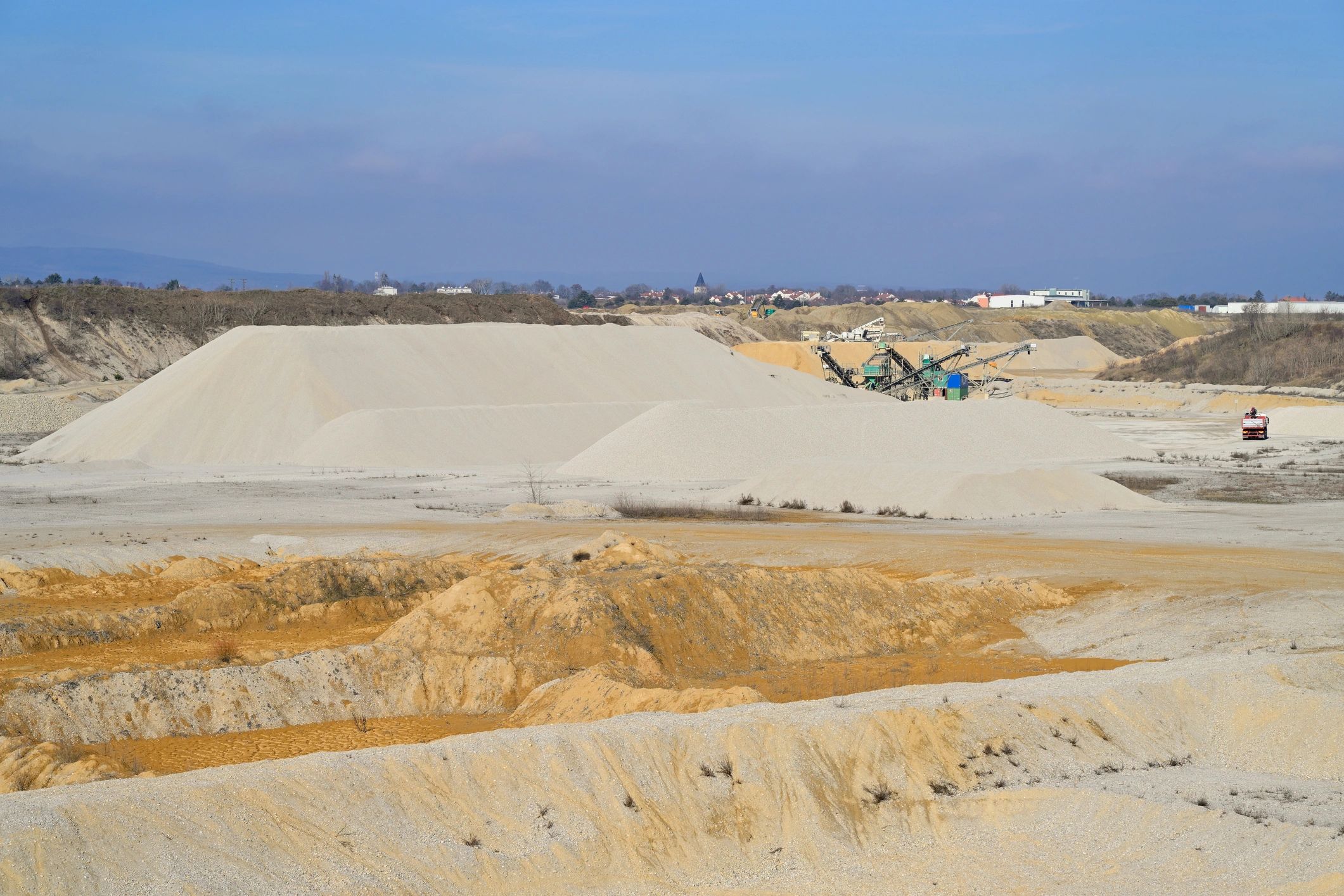 Landscape supply yard with gravel and mulch piles